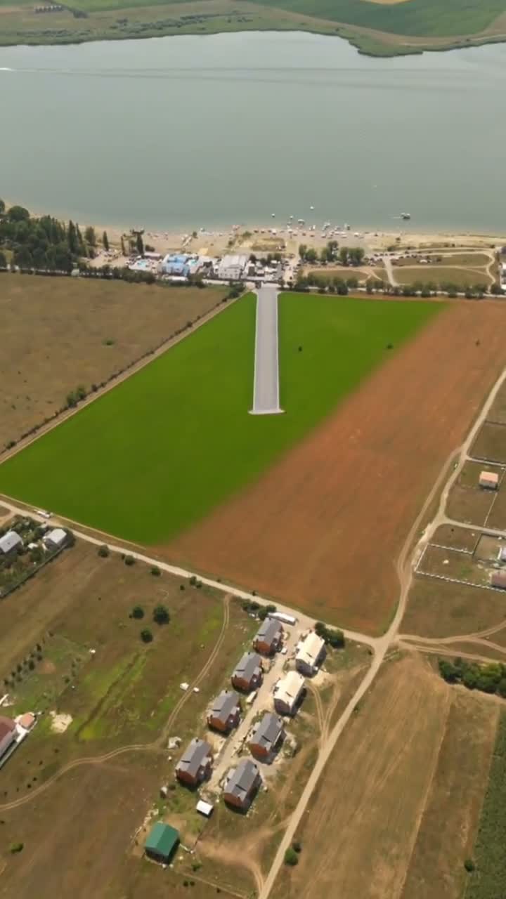 Land and lake in the original Graciel property video; filming credited in the project.